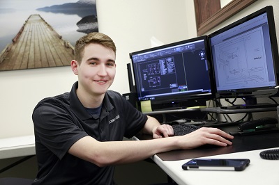 Brandon Mackey at a desk
